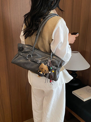 handbag in charcoal with decorative buckle and medium