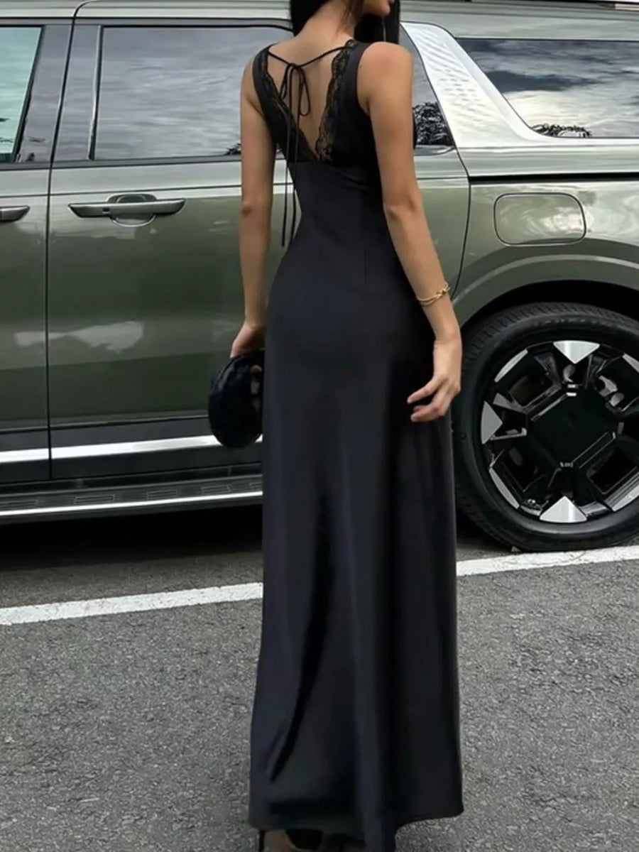Black lace-trimmed sleeveless maxi gown with tie-back detail.