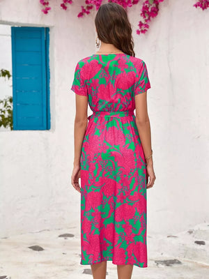 Midi dress with short sleeves, v-neck, and tie waist in a bold floral print.