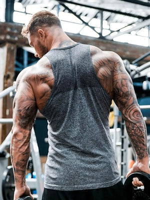 Gray performance knit active tank top with textured detail on back yoke.