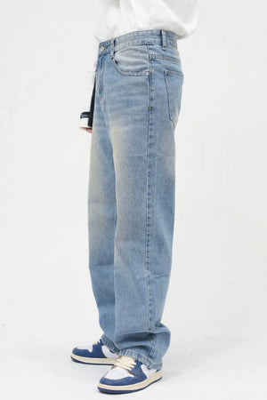 Faded wash relaxed fit jeans in medium blue denim with a casual, breathable style.