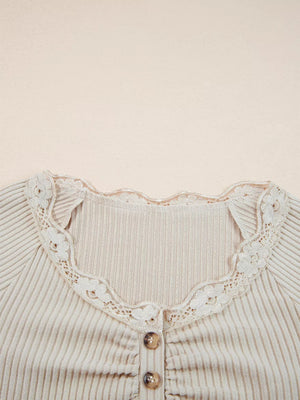 Beige ribbed long-sleeve top with delicate lace trim and button detail.