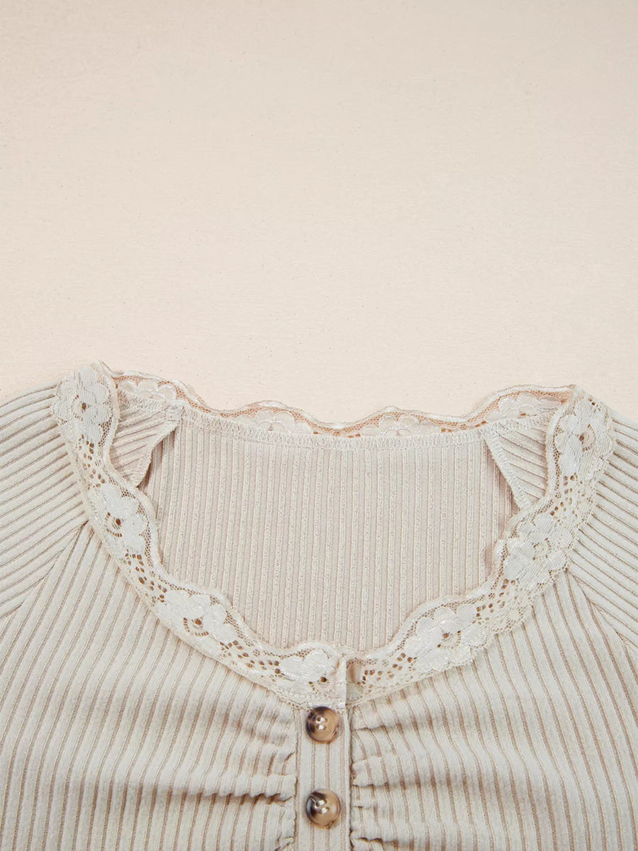 Beige ribbed long-sleeve top with delicate lace trim and button detail.