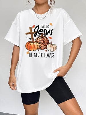 White oversized graphic tee with fall Jesus motif and pumpkins
