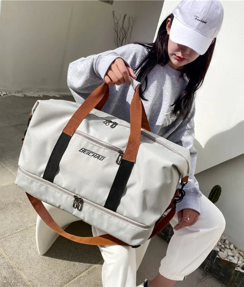 Gray dual-compartment weekender bag with contrast brown and black straps