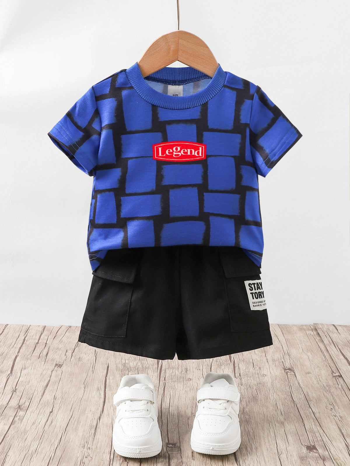 Children's blue graphic tee with "Legend" detail and black cargo shorts set.