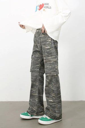 Distressed camo wide-leg cargo jeans in dark gray with multiple pockets.