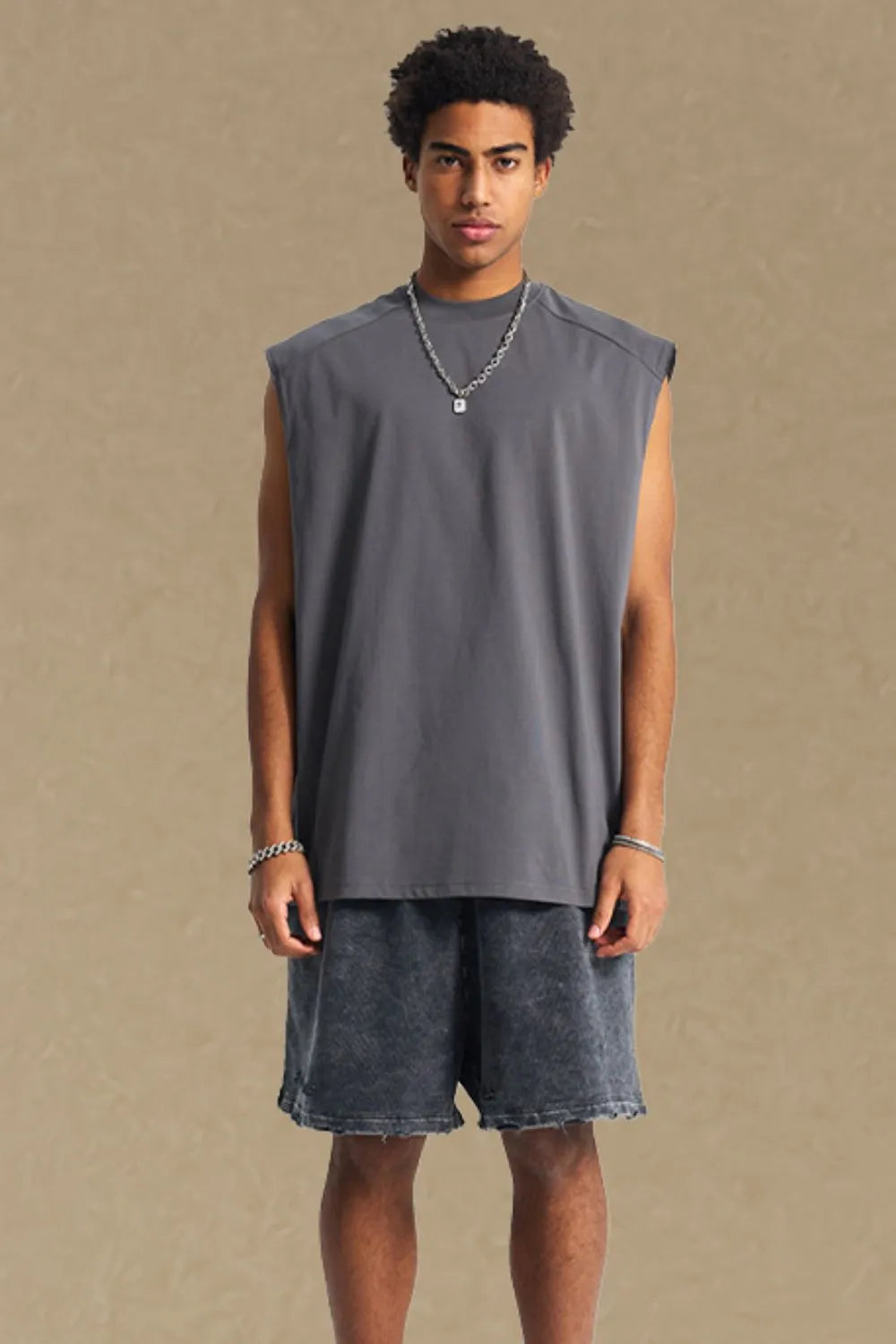 Boxy shoulder cut tank top in dark gray, a casual activewear staple.