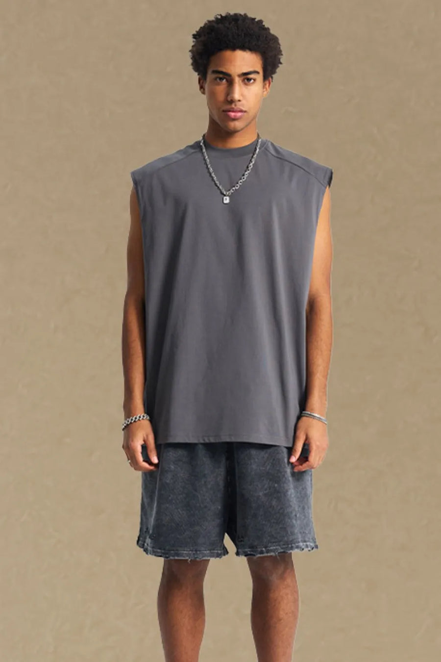 Boxy shoulder cut tank top in dark gray, a casual activewear staple.