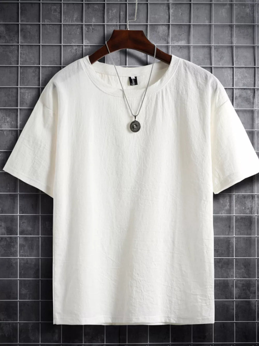 White cotton crew neck t-shirt with subtle texture, short sleeves, and a relaxed fit.