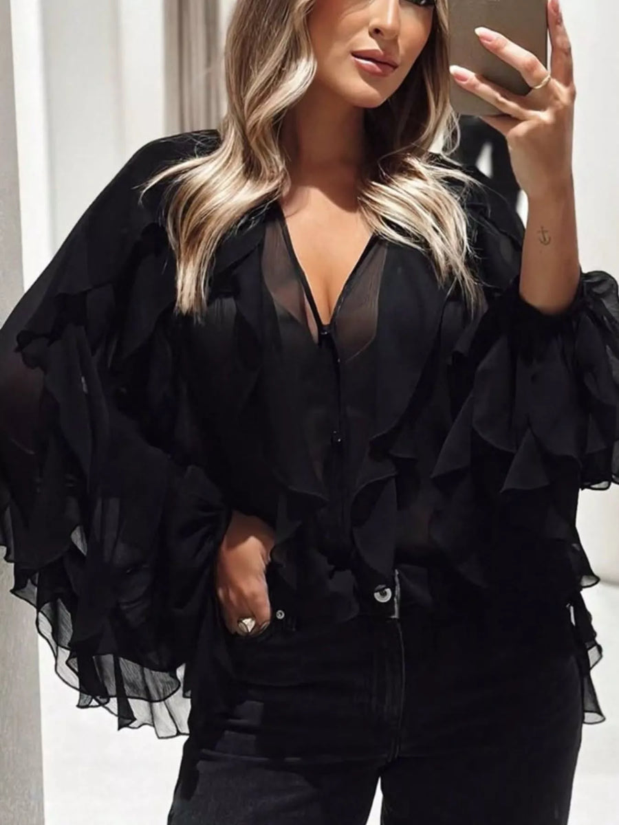 Black sheer long-sleeve blouse with ruffled details and V-neck
