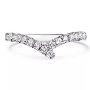silver ring with moissanite stones and none