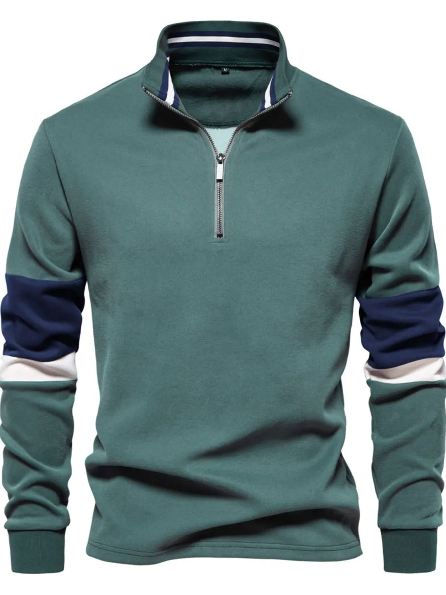 Deep Teal colorblock zip-neck sweatshirt with navy and white sleeve details.