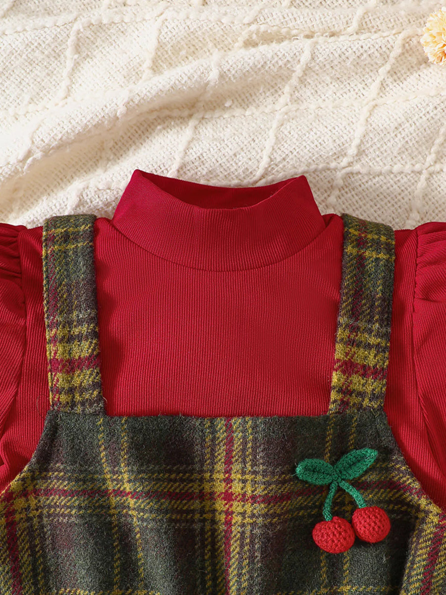 Baby girls' red turtleneck top with plaid jumper dress featuring cherry applique.