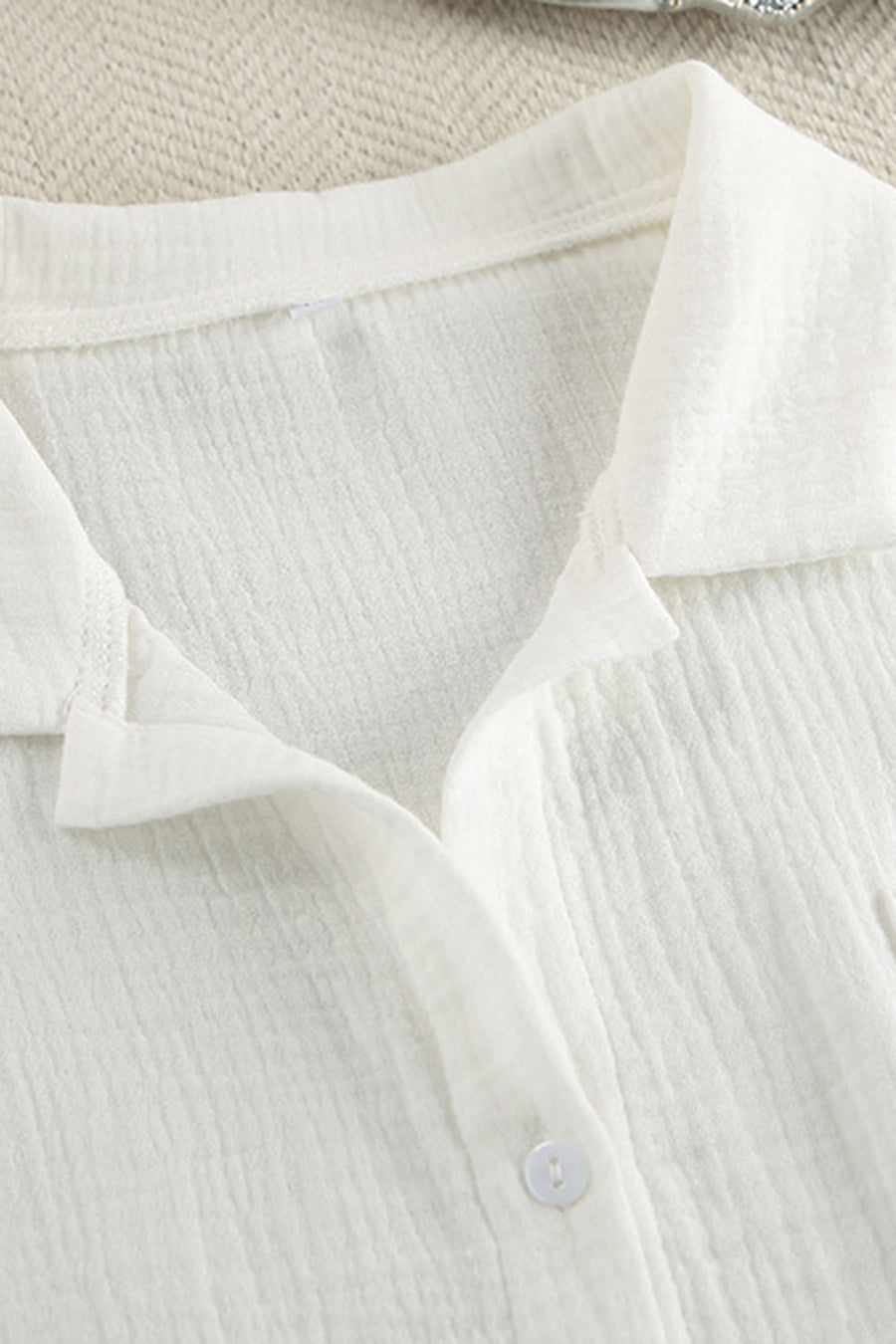 White gauze pajama top with collared neckline and button detail