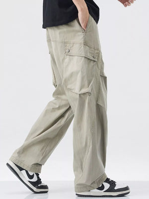 Loose fit khaki cargo pants with drawstring and button flap pockets.