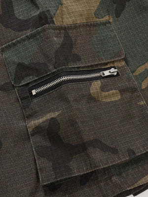 Utility camo cargo shorts in green camouflage with a zippered pocket detail.