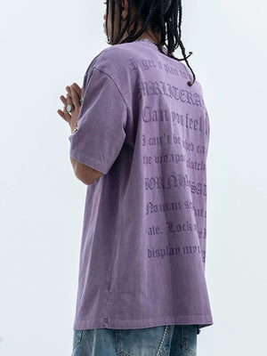 Purple oversized graphic tee with text print, 100% cotton, short sleeves, crew neck.