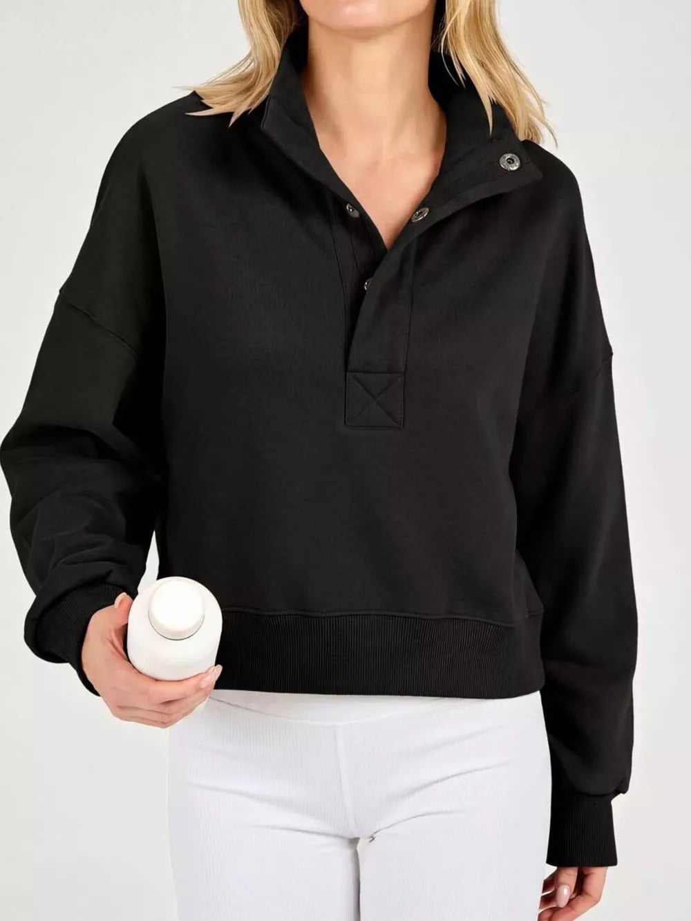 100% polyester Care instructions: Machine wash cold sweatshirt in Black with relaxed silhouette