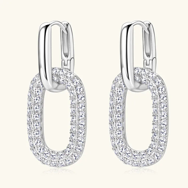 Pave oval link drop earrings in silver with sparkling cubic zirconia accents.