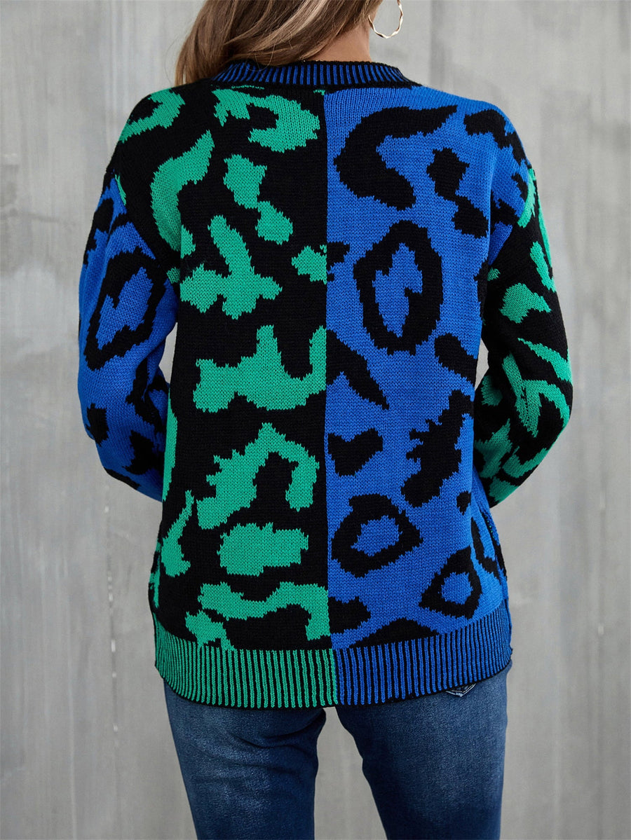 Split leopard knit sweater in blue/green with statement sleeves and crew neck.