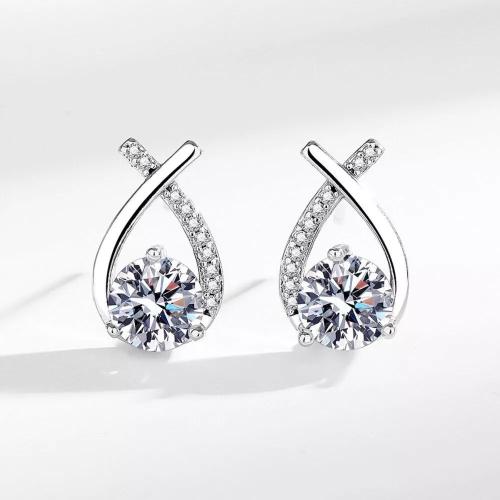 earrings in silver featuring moissanite stones and abstract fit
