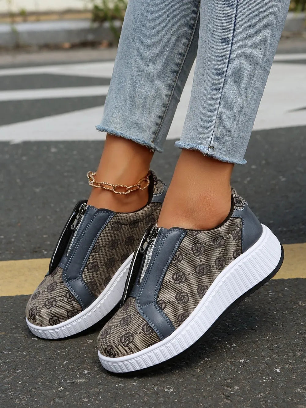Logo print zip-up platform sneakers in tan with gray accents and white soles.