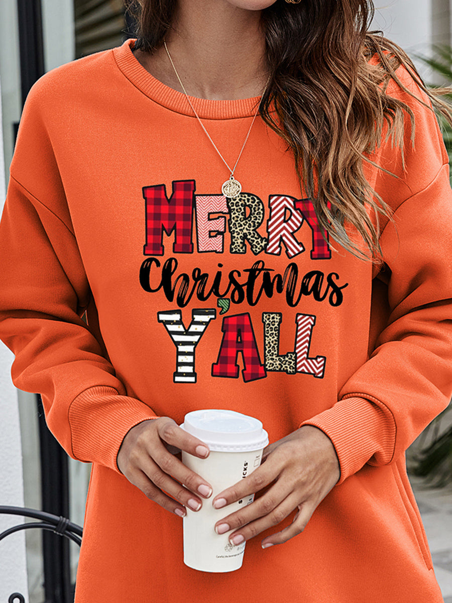 Orange crewneck sweatshirt with Merry Christmas Y'all graphic in plaid and animal print.