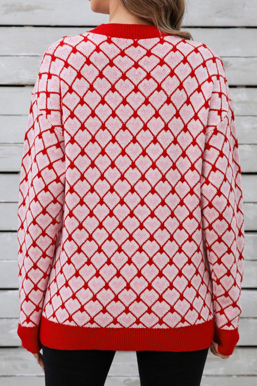 Heart grid crewneck knit sweater in pink and red acrylic with a diamond heart pattern.