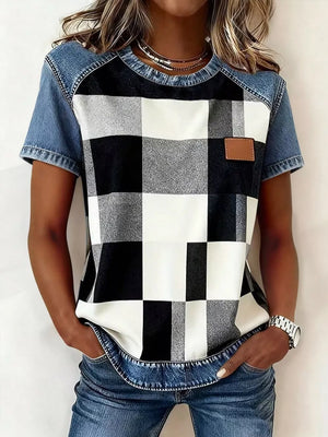 Denim patchwork shirt with black and white buffalo check front, short sleeves, and a brown leather patch detail.