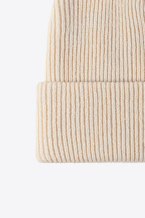 Beige ribbed knit beanie with a cuffed hem