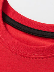 Red cotton t-shirt with black neckline trim and contrast stitching.