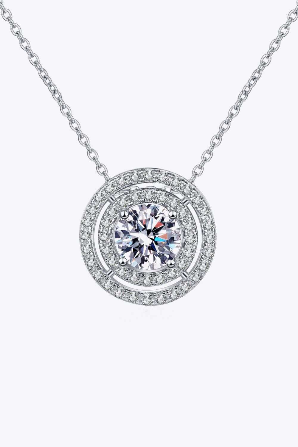 Silver halo diamond pendant necklace with a central round-cut stone.