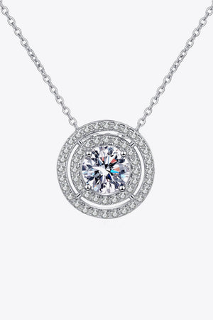 Silver halo diamond pendant necklace with a central round-cut stone.
