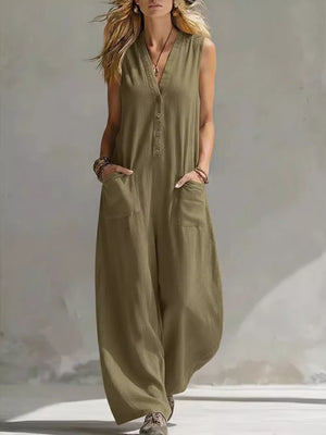 Olive green sleeveless v-neck jumpsuit with button detail and large front pockets
