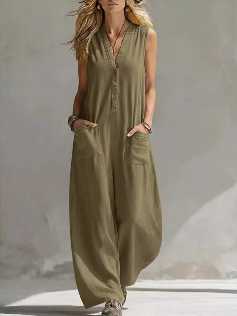 Olive green sleeveless v-neck jumpsuit with button detail and large front pockets