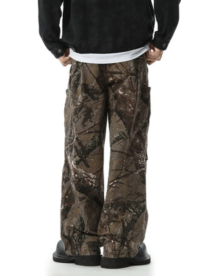 Relaxed fit cargo pants in camouflage pattern with multiple pockets.