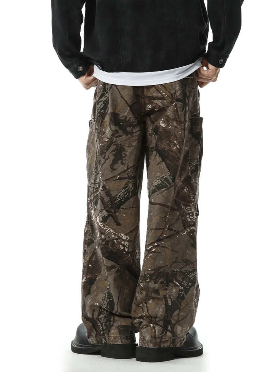 Relaxed fit cargo pants in camouflage pattern with multiple pockets.