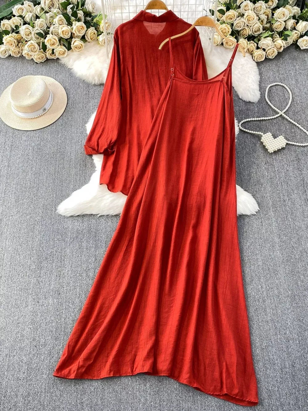 Red embroidered floral two-piece set with collared long sleeve top and spaghetti strap maxi dress.
