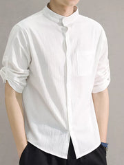 White cotton button-down shirt with roll-up sleeves and chest pocket