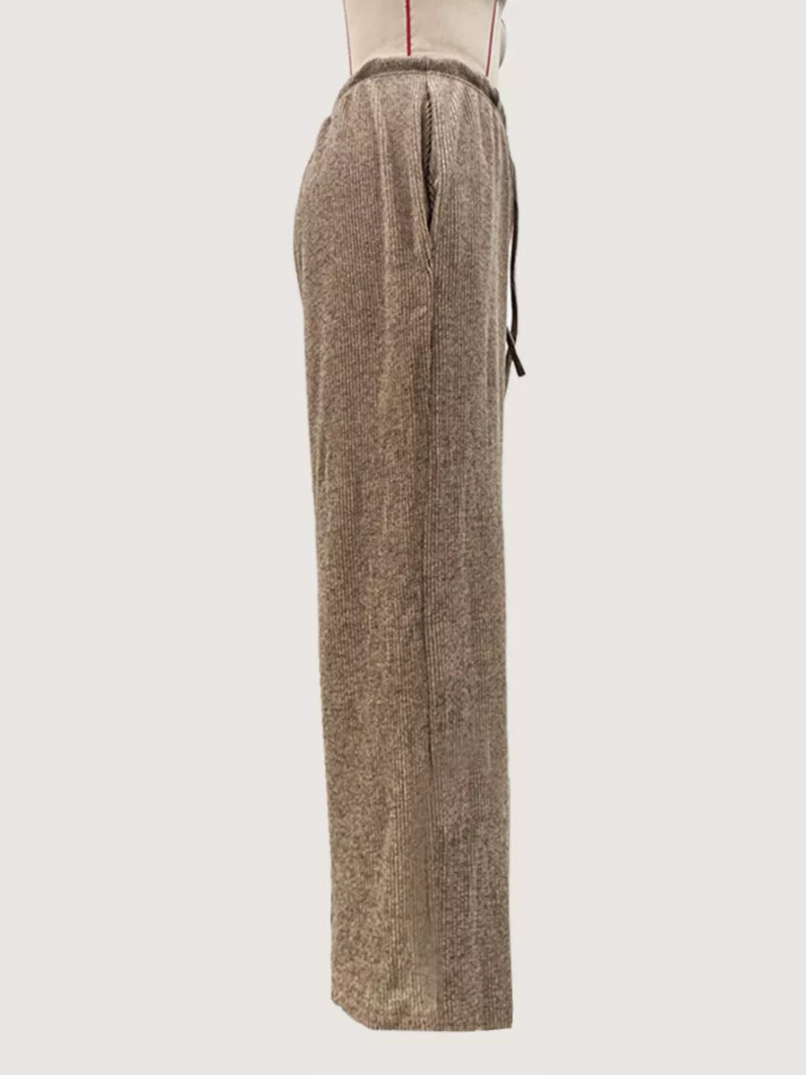 Khaki wide-leg drawstring pants with a ribbed texture and side pockets.
