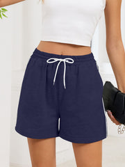 Navy heathered jogger shorts with white drawstring and sporty side trim.