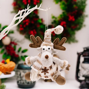 Brown knit reindeer Christmas ornament with snowflake detail and pom-pom hat.