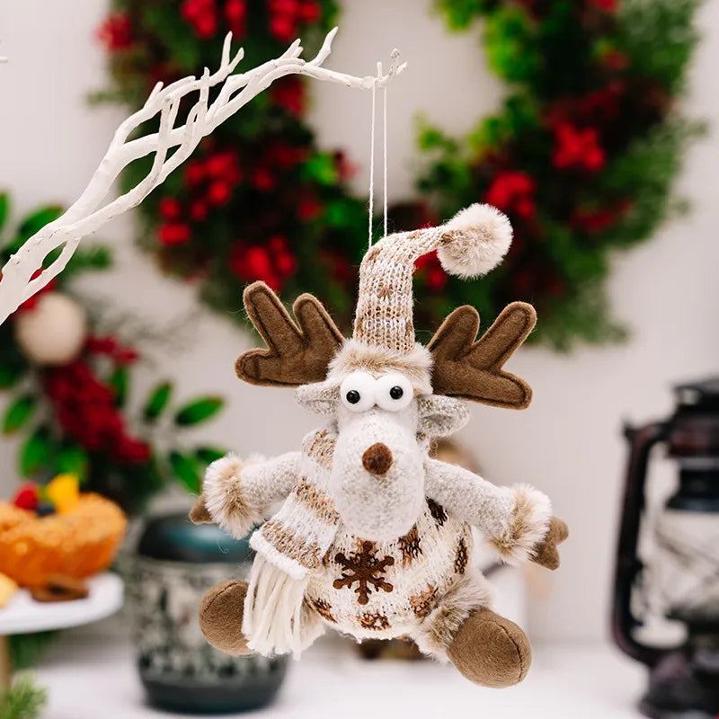 Brown knit reindeer Christmas ornament with snowflake detail and pom-pom hat.