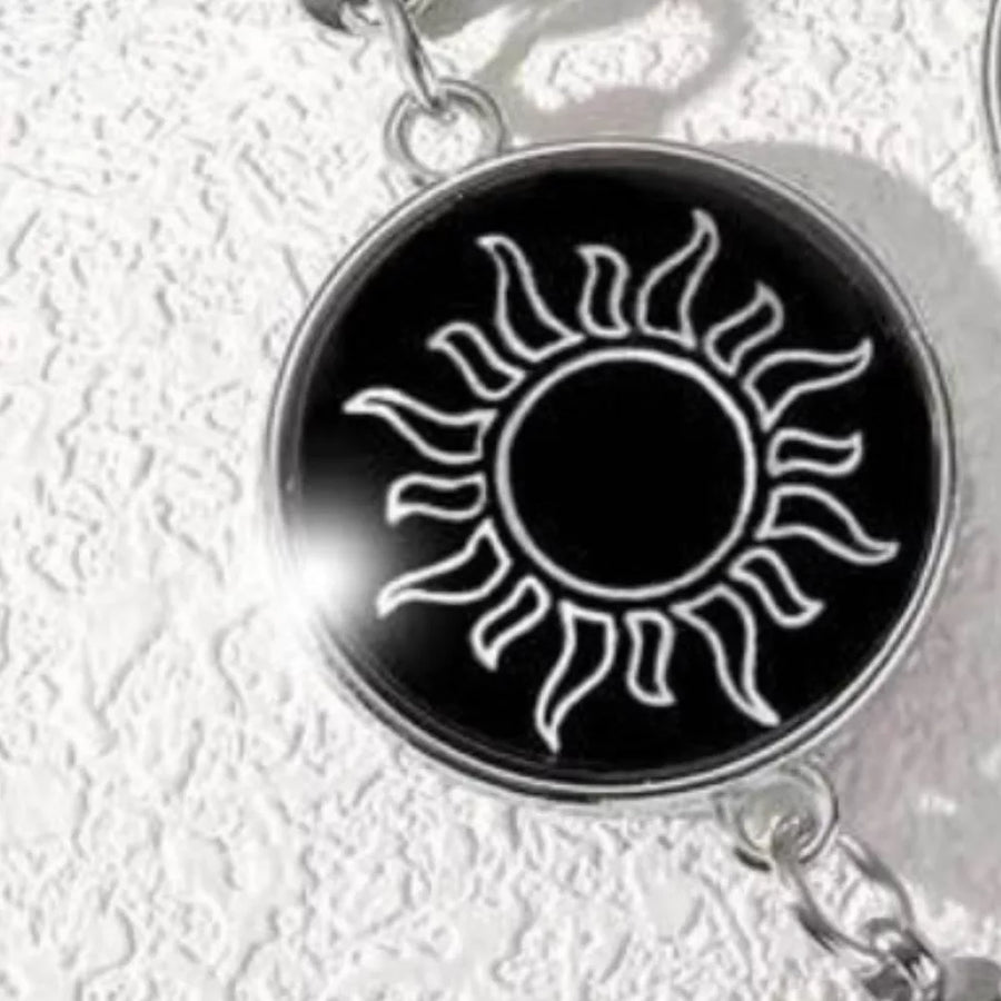 silver bracelet featuring glow-in-the-dark and symbolic