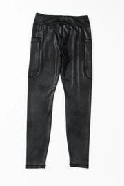 Black faux leather leggings with textured finish and side pockets.
