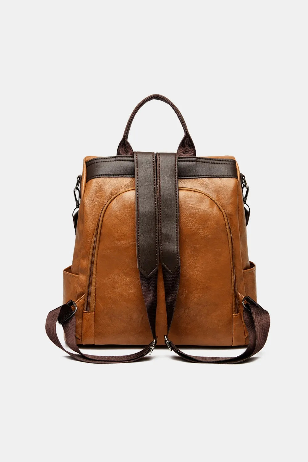 Caramel leather convertible backpack with dual top handles and adjustable shoulder straps.