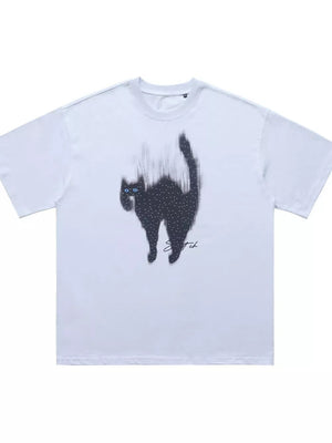 White cotton t-shirt with a black cat graphic and blue rhinestone eyes.