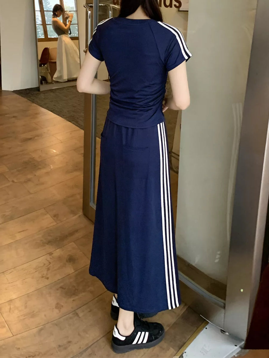 Dark blue midi skirt suit with white stripes on the side and matching tee.