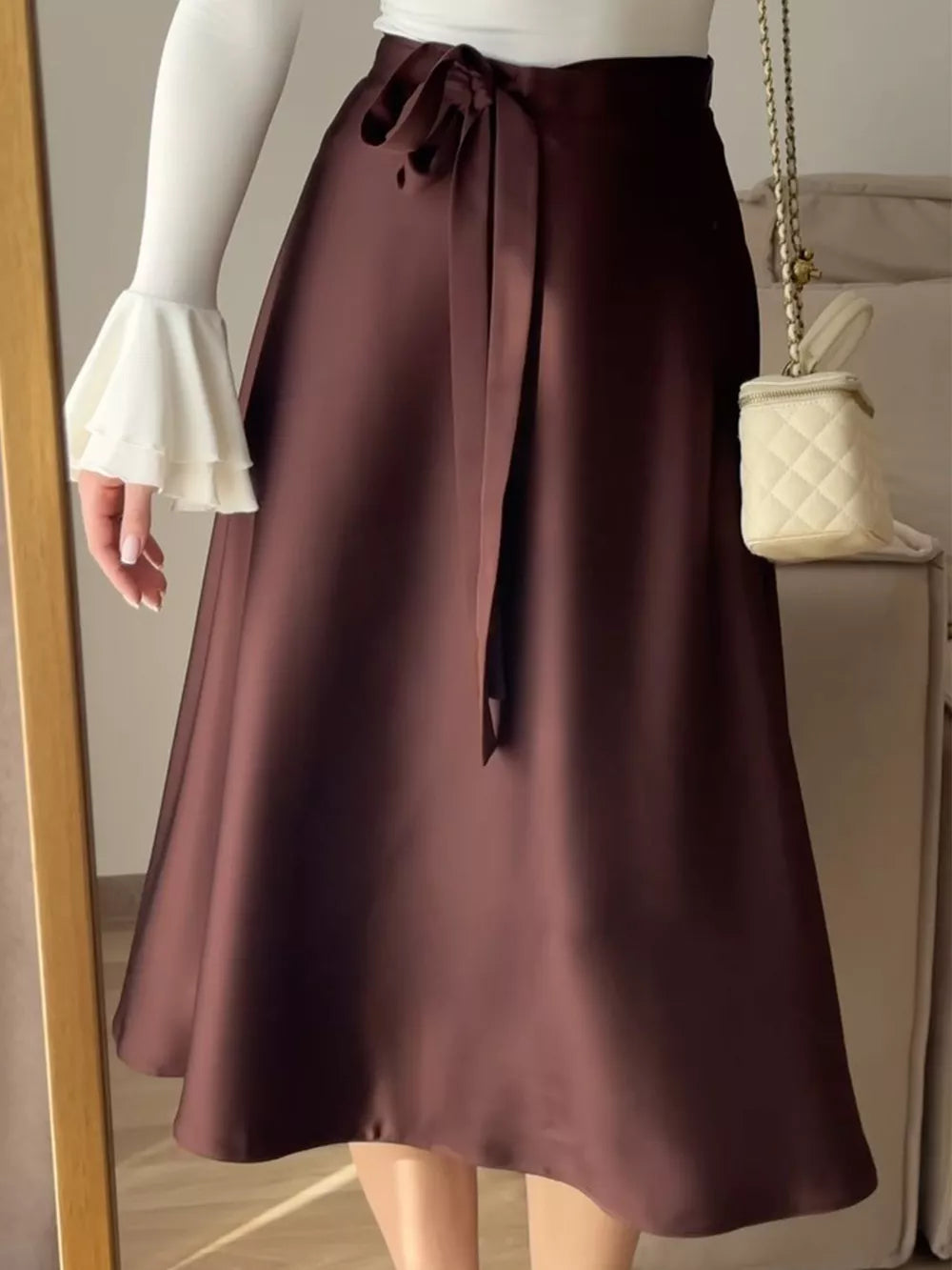 Burgundy satin midi skirt with tie waist and bow detail